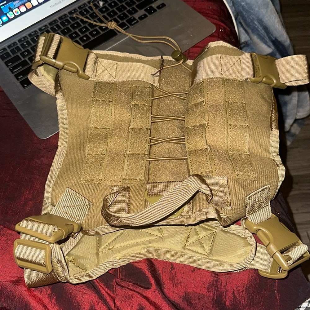 A tan dog harness, it is brand stinking new I got it for my dog but too big